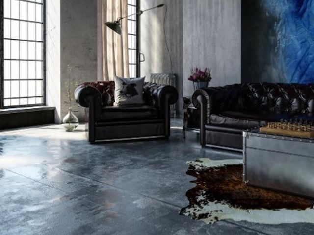 Loft de estética industrial con hormigón pulido gris oscuro